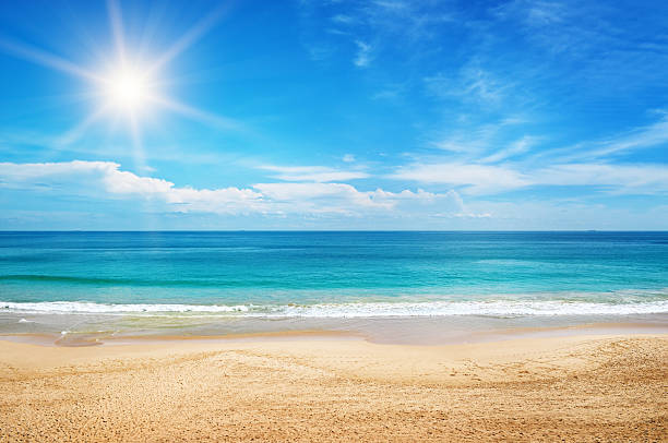 seascape and sun on blue sky background