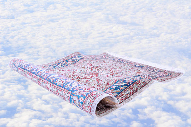 Handwoven antique flying carpet against cloudscape