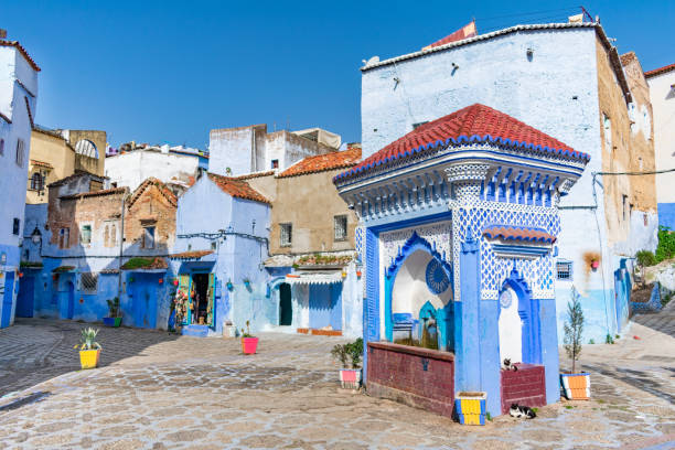 An old decorative blue fountain at Plaza El Hauta in Chefchaouen Morocco